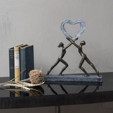 
                  
                    Uplifting Love Couple with Heart Sculpture
                  
                